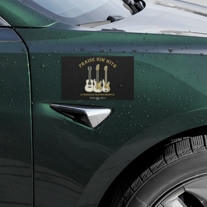 Car door with a sticker featuring guitars and text on a black background